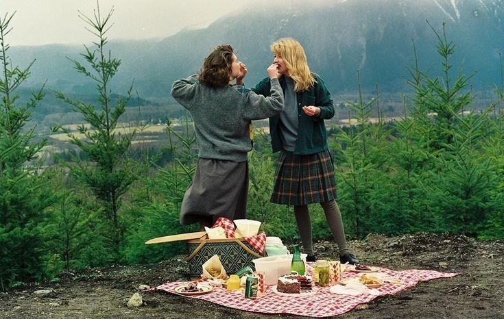 Photo of Laura and Donna feeding each other